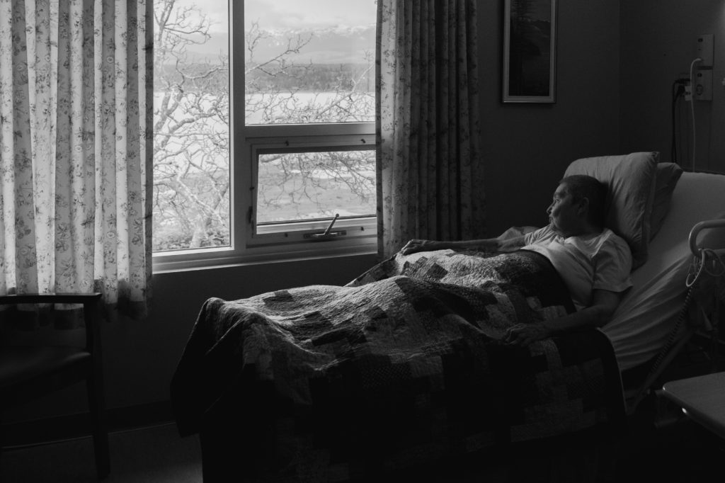 Alphena Franklin-Amor, a Resident in The Views, admires her view from her bed in Oceanview (McKinnon Photography).